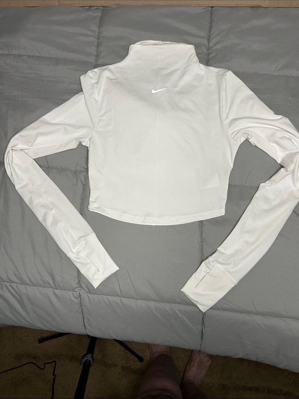 Nike XSmall Crop Dri-Fit long sleeve mock turtleneck with sleeve thumb holes.
